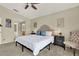 Spacious bedroom with a soft bed, cozy chair, and convenient access to an en-suite bathroom at 80 White Marsh Cir, Orlando, FL 32824
