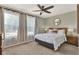 Comfortable bedroom with natural light, light green walls, and ceiling fan at 80 White Marsh Cir, Orlando, FL 32824