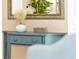A charming decorative table with vase and basket adds character to the home's aesthetic at 80 White Marsh Cir, Orlando, FL 32824