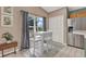 Eat-in kitchen features white appliances, natural lighting, and tile flooring at 80 White Marsh Cir, Orlando, FL 32824