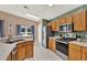 Eat-in kitchen with stainless steel appliances, tile flooring, and ample counter space at 80 White Marsh Cir, Orlando, FL 32824