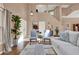 Bright living room featuring an open staircase, neutral color palette, and natural light at 80 White Marsh Cir, Orlando, FL 32824