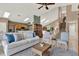 Spacious living room features a staircase, vaulted ceilings, and an open-concept layout at 80 White Marsh Cir, Orlando, FL 32824