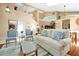 Sun-filled living room featuring vaulted ceilings, an open staircase, and neutral color palette at 80 White Marsh Cir, Orlando, FL 32824