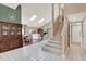 Bright and airy living room featuring cathedral ceilings and an open floor plan with hardwood and tile flooring at 80 White Marsh Cir, Orlando, FL 32824