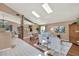 Spacious living room featuring skylights, wood floors, and a neutral color palette at 80 White Marsh Cir, Orlando, FL 32824