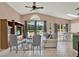 Bright living room with vaulted ceilings, lots of sunlight, and view of pool at 80 White Marsh Cir, Orlando, FL 32824
