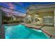 Screened-in pool and patio area featuring a ceiling fan and outdoor furniture, perfect for relaxation and entertainment at 80 White Marsh Cir, Orlando, FL 32824