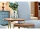 Charming side table is decorated with a glass vase filled with botanicals, adding a natural touch at 80 White Marsh Cir, Orlando, FL 32824