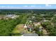Property with a large yard, pool, and lush greenery nestled in a scenic neighborhood at 820 Hobson St, Longwood, FL 32750