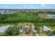 Aerial view shows a home with pool, large yard, and beautiful, green surroundings at 820 Hobson St, Longwood, FL 32750