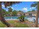 Sprawling backyard featuring an in-ground pool, mature trees, and well-maintained landscaping at 820 Hobson St, Longwood, FL 32750