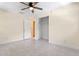 Neutral bedroom with tile floors, ceiling fan, and closet; ready for your personal touch at 820 Hobson St, Longwood, FL 32750