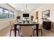 A beautifully decorated dining room featuring a glass table and a chandelier at 820 Hobson St, Longwood, FL 32750