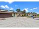 Spacious home featuring a large concrete driveway, garage, and lush landscaping at 820 Hobson St, Longwood, FL 32750