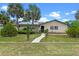 Charming single-story home with well-manicured lawn, desert landscaping, and inviting entrance at 820 Hobson St, Longwood, FL 32750