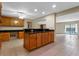Kitchen area with an island and seamless access to a sunny living room at 820 Hobson St, Longwood, FL 32750