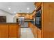Spacious kitchen with stainless steel appliances and wood cabinets at 820 Hobson St, Longwood, FL 32750
