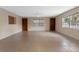 Large living room featuring neutral walls, tile floors, built-in shelves, and natural light at 820 Hobson St, Longwood, FL 32750