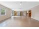 Open-concept living area with tile flooring and a seamless flow into the kitchen and dining spaces at 820 Hobson St, Longwood, FL 32750