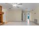 An open-concept living area with brick fireplace, tile floors, and neutral walls at 820 Hobson St, Longwood, FL 32750
