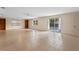 Spacious living room showcasing tile flooring, built-in shelves, and pool access at 820 Hobson St, Longwood, FL 32750