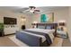 Furnished bedroom with a large bed, TV, and bathroom access at 820 Hobson St, Longwood, FL 32750