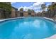 Large pool with steps, safety fence, and nearby access to the home's sliding glass door at 820 Hobson St, Longwood, FL 32750
