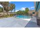 Backyard pool with safety fence and ample patio space with palm tree landscaping at 820 Hobson St, Longwood, FL 32750