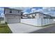 Fenced backyard providing privacy to the property, with a driveway leading up to the house's garage at 8563 Compass Point Ave, Orlando, FL 32832