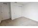 Clean bedroom featuring neutral carpet, white walls, closet and adjacent wall closet with double doors at 8563 Compass Point Ave, Orlando, FL 32832