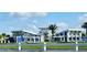 View of the community clubhouse, featuring a covered outdoor area, set against a blue sky at 8563 Compass Point Ave, Orlando, FL 32832