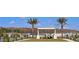 Community space featuring lawn, seating, landscaping, pond, and attractive residential architecture at 8563 Compass Point Ave, Orlando, FL 32832