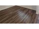 Close-up of attractive new brown laminate wood flooring in the house at 8563 Compass Point Ave, Orlando, FL 32832