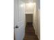 Hallway with wood-style floors leads to a bright space at 8563 Compass Point Ave, Orlando, FL 32832