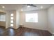 Bright living room showcasing the laminate wood flooring and open layout at 8563 Compass Point Ave, Orlando, FL 32832