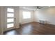 Bright living room with modern ceiling fan and beautiful laminate wood flooring at 8563 Compass Point Ave, Orlando, FL 32832