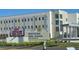 Exterior of Innovation High School with modern architecture and well-maintained landscaping at 8563 Compass Point Ave, Orlando, FL 32832