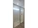 Glass-enclosed shower with subway tile and natural light at 8563 Compass Point Ave, Orlando, FL 32832
