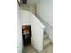 Staircase leading to a modern kitchen and lower level at 8563 Compass Point Ave, Orlando, FL 32832