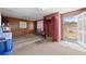 The basement has carpet and brick walls with storage and access to the outside at 1010 Timor Ave, Orlando, FL 32804