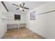 The room features tile flooring, windows with blinds, and built-in shelving and table at 1010 Timor Ave, Orlando, FL 32804