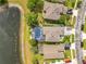 Aerial of backyard with screened-in pool and view of community pond at 10142 Hidden Dunes Ln, Orlando, FL 32832