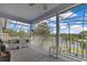 Balcony with lake view, features neutral outdoor seating at 10142 Hidden Dunes Ln, Orlando, FL 32832