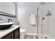 Modern bathroom with sleek vanity, vessel sink, and tiled walk-in shower at 10142 Hidden Dunes Ln, Orlando, FL 32832