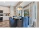 Open dining area with white cabinets, bright natural light, and views of the patio at 10142 Hidden Dunes Ln, Orlando, FL 32832