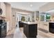 Kitchen area features a center island, white cabinets, a dining nook and tons of natural light at 10142 Hidden Dunes Ln, Orlando, FL 32832