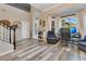 Bright and airy living area boasts beautiful wood floors and large windows that let in ample natural light at 10142 Hidden Dunes Ln, Orlando, FL 32832