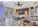 Luxurious main bedroom with a tray ceiling and balcony at 10142 Hidden Dunes Ln, Orlando, FL 32832