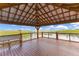 The covered pavilion offers a scenic view of the lake and seating at 10142 Hidden Dunes Ln, Orlando, FL 32832